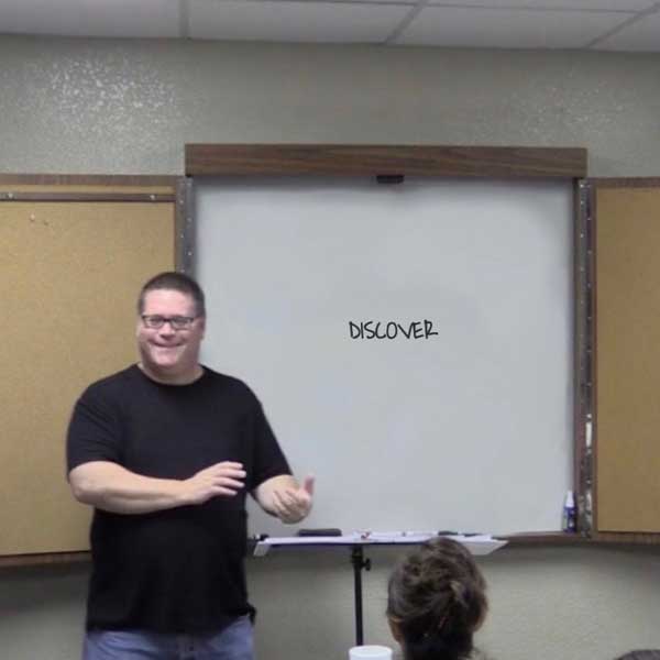 Man by whiteboard